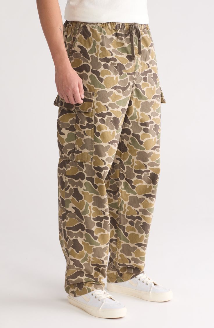 These baggy cargo pants are designed with a slightly tapered leg and styled with utility flap pockets for a signature laid-back look. Elastic/drawstring waist Front slant pockets; coin pocket; cargo flap-patch pockets 100% cotton Machine wash, tumble dry Imported Baggy Combat Cotton Cargo Pants, Baggy Cotton Combat Cargo Pants, Cotton Combat Cargo Pants, Cotton Combat Cargo Pants Full Length, Combat Style Cotton Cargo Pants, Military Style Baggy Wide Leg Cargo Pants, Combat Wide-leg Pants With Multiple Pockets, Baggy Military Style Cargo Pants With Wide Leg, Baggy Military Wide Leg Cargo Pants