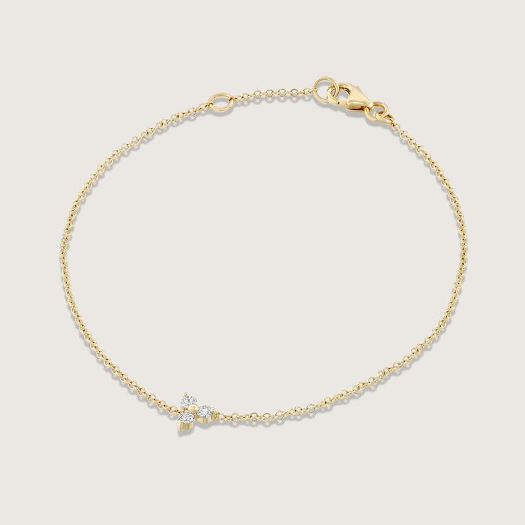 This gorgeous, dainty bracelet is the one piece of jewelry no woman can resist. It is subtle, while still exuding elite design.  Delicate and beautiful 14K gold chain which displays a central floral shaped element with 3 natural white diamonds. This minimalist design,is a great gift idea for any special occasion, an anniversary gift or even a birthday gift that shows how happy you want to make her.  ------------------------- Features: 14K gold Natural white Diamonds Total diamond weight: 0.09 ca Gold Delicate Chain Diamond Bracelet, Delicate 14k Gold Bracelet With Delicate Chain, Delicate Gold Diamond Bracelet With Single Diamond, Dainty 14k Gold Diamond Bracelet, Delicate Yellow Gold Diamond Bracelet With Delicate Chain, Delicate Yellow Gold Diamond Bracelet With Chain, Dainty Yellow Gold Chain Bracelet, Dainty Yellow Gold Diamond Bracelet, Delicate Diamond Bracelet With Adjustable Chain In Yellow Gold