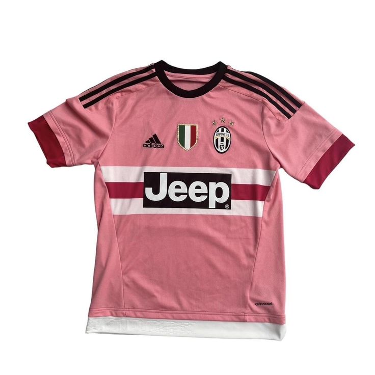 a pink soccer jersey with black and white stripes on the chest, in front of a white background