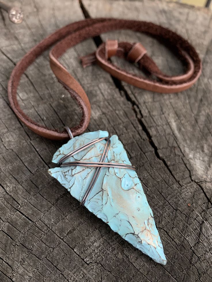 "This is my fresh spin on a wire wrapped classic. Arrowheads have been worn as jewelry for ages and are a recognizable symbol of alertness, walking the straight and narrow & strength. The arrowhead I used is made of jasper stone and is a hand knapped modern replica. It was made in the same tradition and with the same primitive techniques that early man used. I added a lovely pale turquoise & gold highlight patina then wire wrapped it with blackened (oxidized) copper wire. This is a great Artisan Adjustable Turquoise Pendant Necklace, Adjustable One-of-a-kind Turquoise Necklace For Festivals, Adjustable Southwestern Hand Wrapped Jewelry, Southwestern Hand Wrapped Adjustable Jewelry, Southwestern Adjustable Hand Wrapped Jewelry, Handmade Turquoise Jewelry With Waxed Cord, Adjustable Southwestern Style Hand Wrapped Jewelry, Bohemian Turquoise Jewelry With Waxed Cord, Bohemian Turquoise Jewelry On Waxed Cord