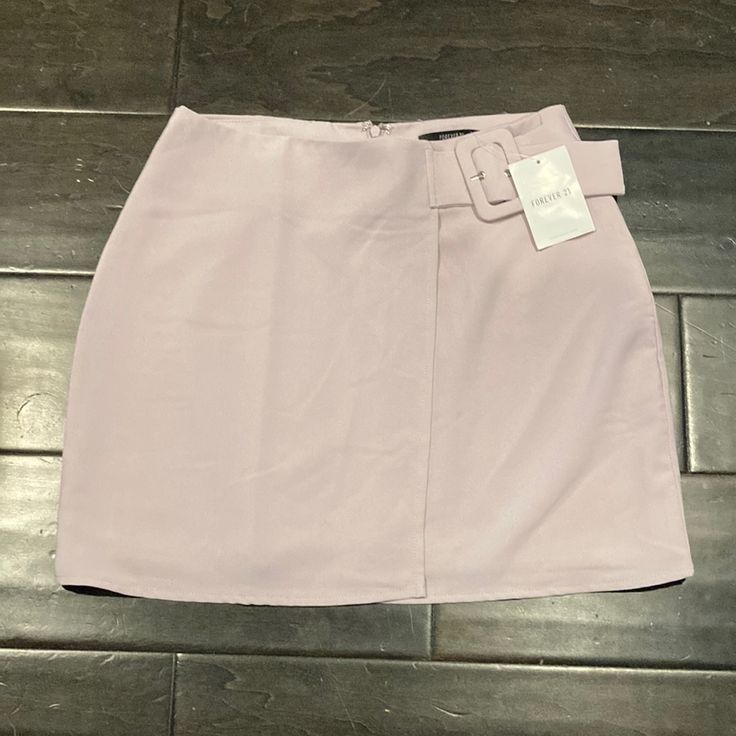 This Is A Super Cute Asymmetric Miniskirt From Forever 21 With A Built In Side Belt On The Waist. It Is Brand New With Tags - I’m Selling Because I Originally Ordered It Online And It Didn’t Fit. The Tag Says “Lavender” But I Would Describe It As More Of A Dusty Lilac Color Because The Purple Is More Subtle Than Vibrant (If That Makes Any Sense). It Kills Me That This Doesn’t Fit Because I Love This Skirt So Much, So Hopefully You Will Love As Much As I Do And Wear It All The Time! Size Medium, Spring Mini Skort For Date Night, Trendy Fitted Asymmetrical Skort, Date Night Asymmetrical Lined Mini Skirt, Spring Date Night Lined Mini Skirt, Asymmetrical Skirt For Date Night In Spring, Spring Mini Hem Skirt For Night Out, Mini Hem Skirt For Night Out In Spring, Mini Hem Skirt For Spring Night Out, Spring Mini Skirt For Date Night