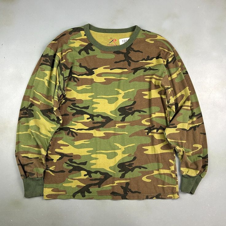 VINTAGE ' Military Army Camo Long Sleeve T-Shirt sz M Adult CONDITION : Wear and fading from age. No stains or holes. Overall good condition! *This shirt has been washed - Please review pictures* TAGGED SIZE : ** Adult Mens L** ( Fits : Mens M ) MEASUREMENTS : *Please see photos above for measurements. *Disclaimer: All measurements are in inches and are taken laying flat on the ground* *Please review pictures, condition and refer to measurements before purchasing for a more accurate fit: SHIPPIN Military Style Crew Neck T-shirt For Streetwear, Military Crew Neck T-shirt For Streetwear, Military Crew Neck T-shirt, Fall Camouflage T-shirt With Crew Neck, Military Style Cotton T-shirt With Crew Neck, Fall Camouflage Crew Neck T-shirt, Green Military Crew Neck Top, Military Cotton Tops For Streetwear, Military Style Cotton Tops For Streetwear