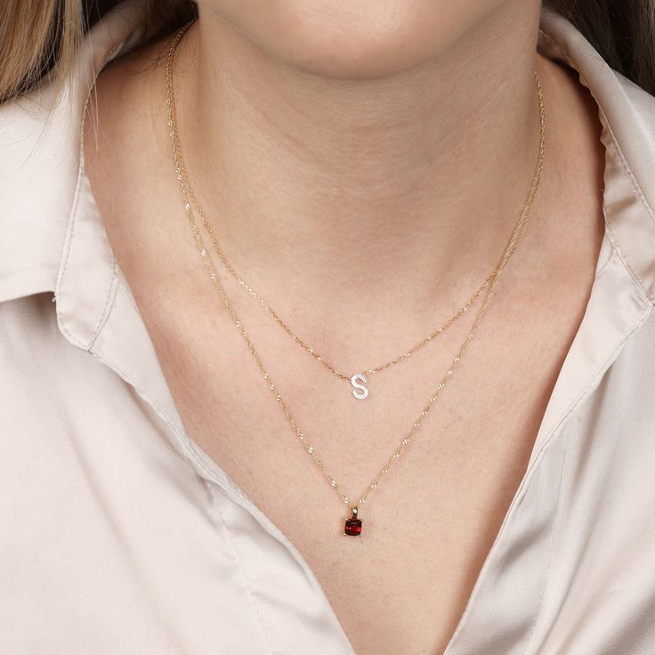 Take your style up a notch with this rich Garnet pendant-necklace. This stunning 4 prong cushion cut Garnet pendant is a perfect gift for her. Featuring 16"-18" adjustable gold chain. Gemstone Details: Gemstone : Garnet Stone Cut : Cushion, Color : Red Weight - 5x5mm Gold Details: Learn More 14 Karat Yellow Gold All colors of gold are nickel free and hypoallergenic. Yellow Gold Cushion Cut Necklace As A Gift, Cushion Cut Yellow Gold Necklace Gift, Cushion Cut Birthstone Jewelry Gift, Cushion Cut Birthstone Jewelry For Gifts, Fine Jewelry Cushion Cut Gift, Gold Jewelry With Cushion Cut Birthstone, Gold Cushion Cut Birthstone Jewelry, Yellow Gold Cushion Cut Necklace Fine Jewelry, January Birthstone Jewelry