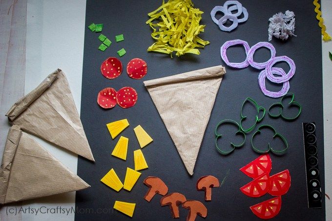 an assortment of crafting materials are laid out on a sheet of paper and placed next to each other