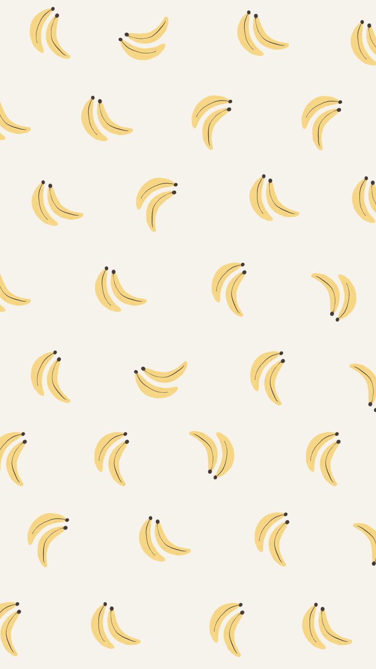 a bunch of yellow bananas on a white background with black dots in the bottom corner