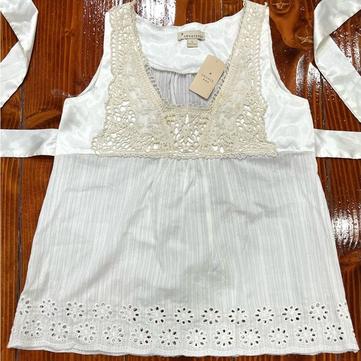 Cotton Sleeveless Blouse From Twenty One. Gorgeous Embroidered Details And Designs On The Front And Bottom. Floral Trim. Silk Ties For The Back. Excellent Quality And Condition Since Never Worn Before. Spring Cotton Camisole With Lace Top, Summer Cotton Lace Camisole Top, Cotton Camisole With Lace Top For Spring, White Spring Vest For Vacation, Casual Summer Vest With Lace Trim, Summer Sleeveless Blouse Camisole With Lace Trim, Spring Cotton Lace Tank Top, Sleeveless Summer Tops With Lace Trim, Cotton Lace Tank Top For Spring