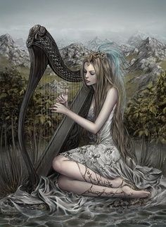 a woman sitting on the ground playing a harp