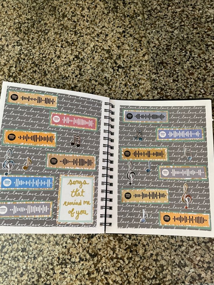 an open notebook with stickers on it