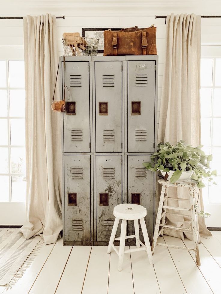 an old locker is next to a white stool