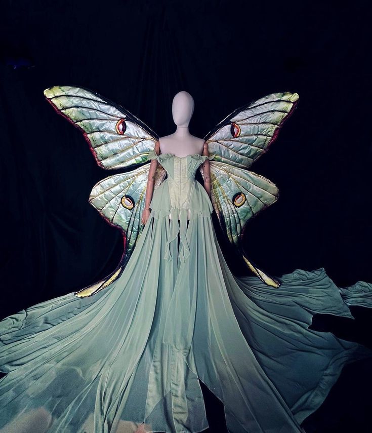 a mannequin dressed as a butterfly with wings