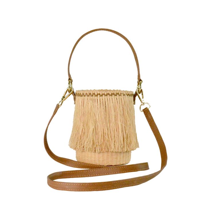 Frayed Mini Bucket 100% Toquilla Straw. This material is known for its quality and beauty. Each bag is entirely hand-made, from the straw dye to the weaving of the bag. -Measures approximately High: 15 Cm Width: 11 Cm Handle: 14 Cm - We ship with DHL Express. Shipping takes approximately 3 to 5 days to arrive depending on the destination. -Need Help? Please contact: customercare@sensistudio.com -All Sales Are Final. Luxury Natural Straw Bucket Bag, Luxury Handwoven Brown Bucket Bag, Luxury Brown Handwoven Bucket Bag, Luxury Beige Basket Bucket Bag, Luxury Woven Straw Bag In Natural Color, Beige Leather Basket Bucket Bag, Elegant Natural Bucket Bag With Bamboo Handle, Elegant Handwoven Natural Bucket Bag, Leather Bucket Bag With Bamboo Handle In Natural Color