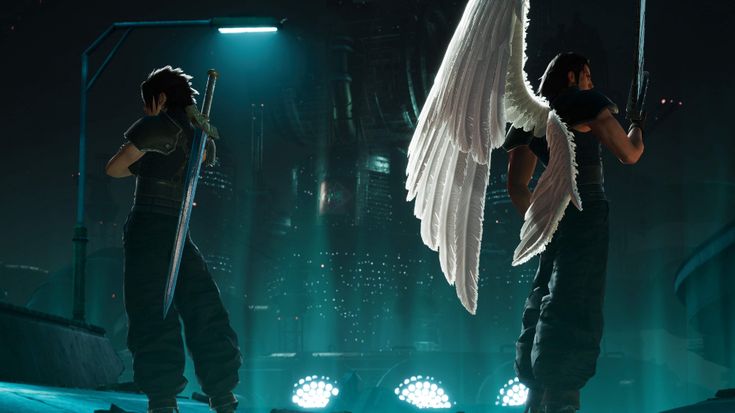 two people with angel wings standing on stage