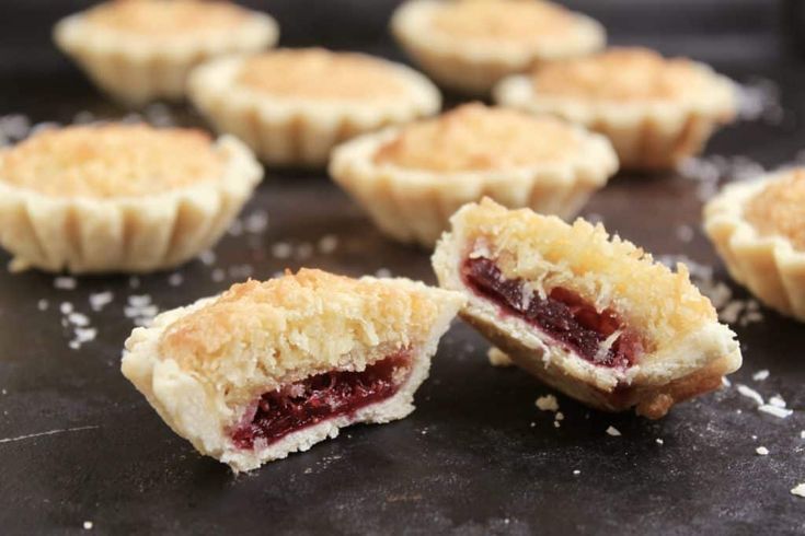 several small pastries on a black surface