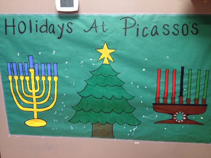 a bulletin board with menorah candles and a christmas tree in the center that says holidays at picassos