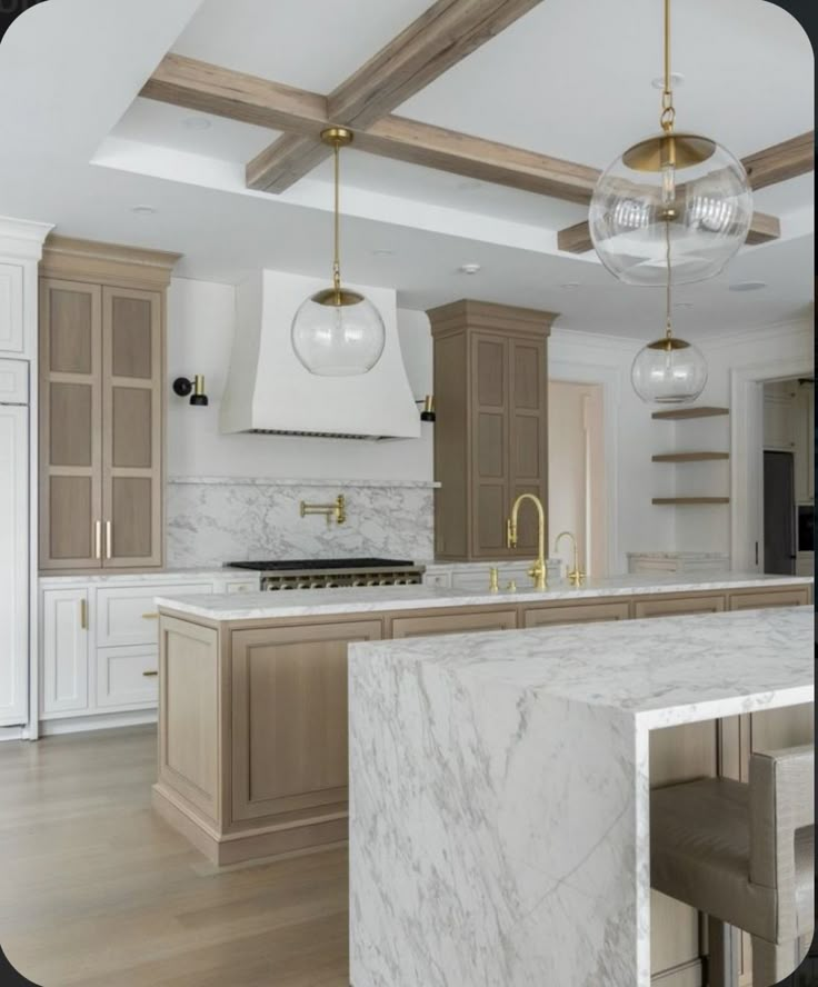 a large kitchen with marble counter tops and wooden beams