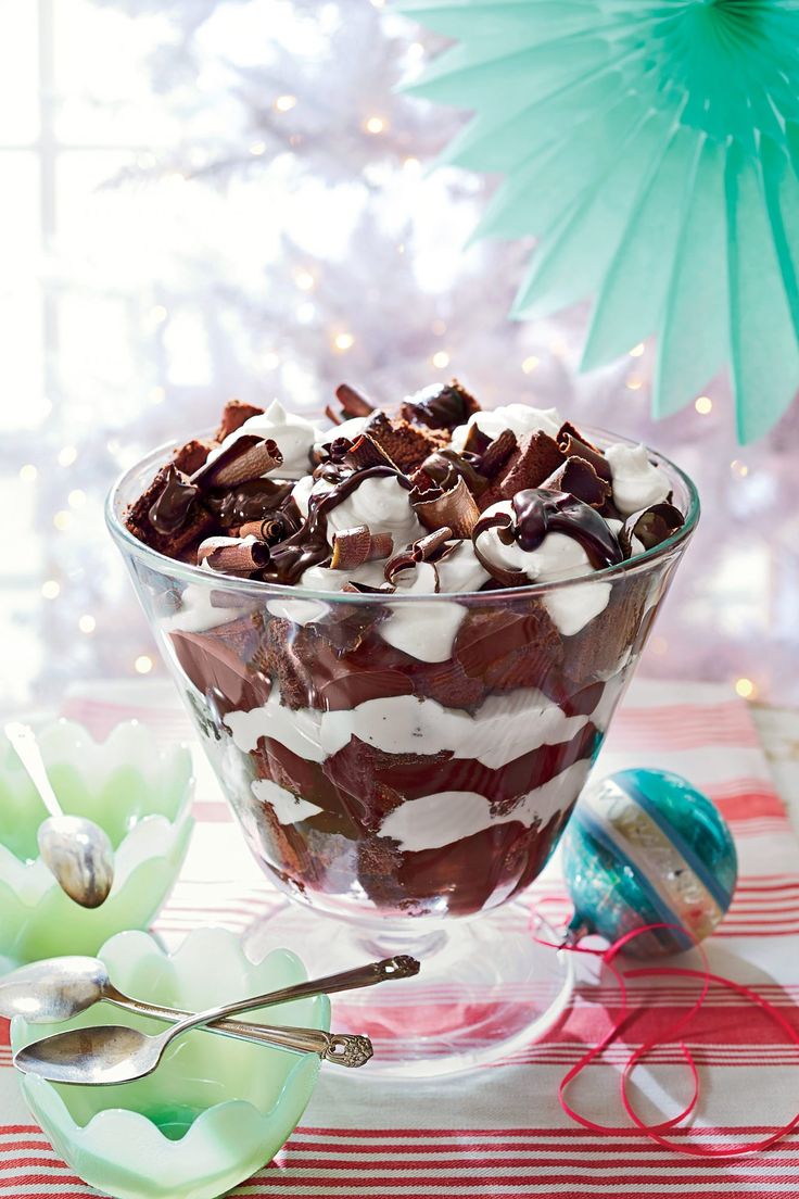 a bowl filled with chocolate and marshmallows on top of a table