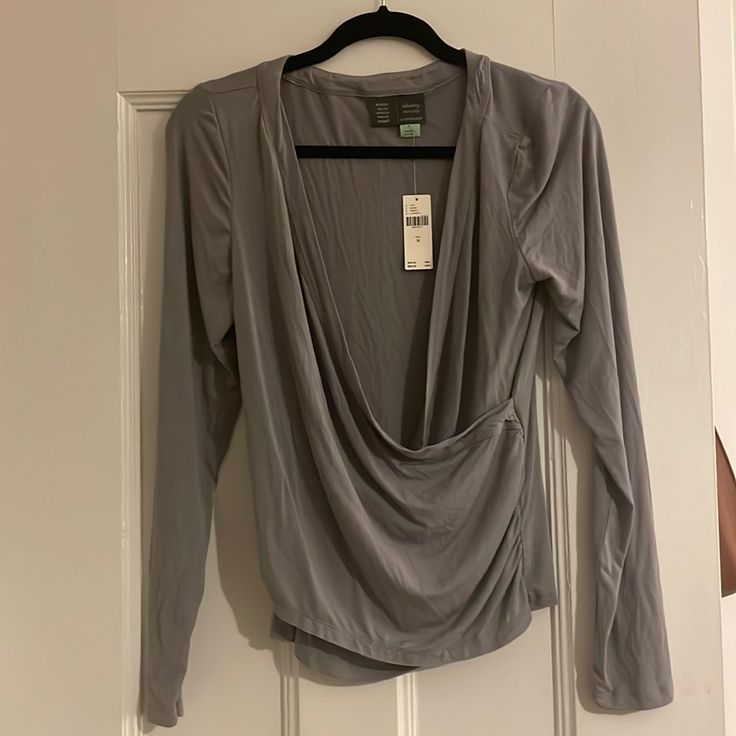 Super Soft Modal Fabric, Flattering Ruching On Both Sides. Runs Tts. Chic Long Sleeve Faux Wrap Top, Faux Wrap Tops For Layering In Spring, Spring Faux Wrap Tops For Layering, Stretch Wrap Top For Fall, Chic Faux Wrap Top For Layering, Long Sleeve Faux Wrap Top For Layering, Spring Stretch Faux Wrap Tops, Long Sleeve Faux Wrap Blouse For Fall, Faux Wrap Long Sleeve Blouse For Fall