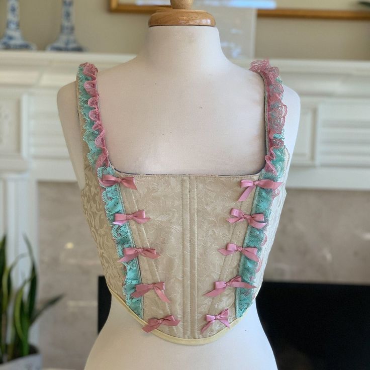 Marie Antoinette Pink Bow Corset - Etsy Sleeveless Beige Corset With Corset Back, Beige Sleeveless Corset With Corset Back, Pink Lace Trim Underbust Corset, Pink Underbust Corset With Lace Trim, Pink Underbust Corset With Boning, Pink Feminine Underbust Corset, Pink Underbust Feminine Corset, Feminine Pink Underbust Corset, Fitted Ruffled Corset In Balletcore Style