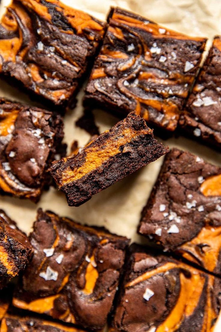 chocolate brownies with orange and white sprinkles on top, cut into squares