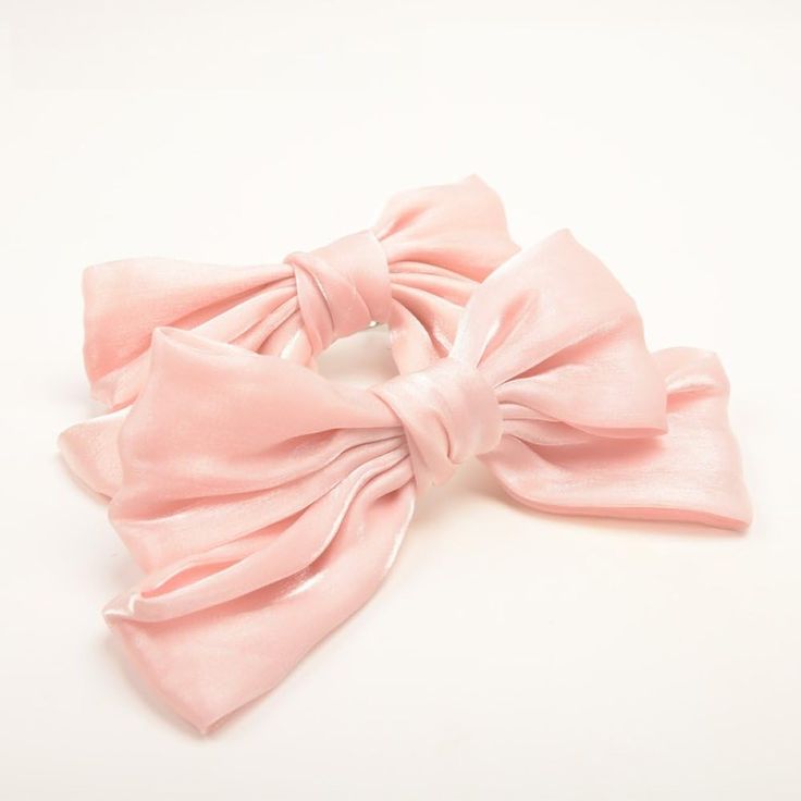 a pink bow on a white background