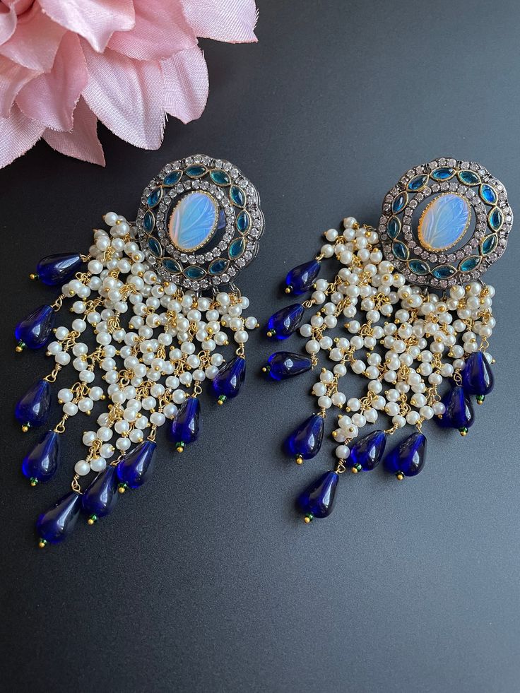 These earrings come in 3 different beautiful colors with a handmade vintage look. It comes in Blue, red, and gray tone and has small beads/pearls as addition to create a statement look. They are gorgeous for a night out and elegant for any outfit as this is a very unique piece and can be paired with many colors. Perfect for gifting and for anyone that loves jewelry, this pair of earrings is sure to leave a mark! Elegant Beaded Earrings With Dangling Beads For Festivals, Elegant Dangling Beads Earrings For Festivals, Elegant Dangling Beaded Earrings For Festivals, Elegant Chandbali Beaded Earrings With Dangling Beads, Elegant Danglers With Dangling Beads For Festivals, Elegant Danglers With Beads For Festivals, Elegant Festival Danglers With Beads, Elegant Pearl Earrings With Dangling Beads For Festivals, Elegant Beaded Earrings With Dangling Beads For Festive Occasions