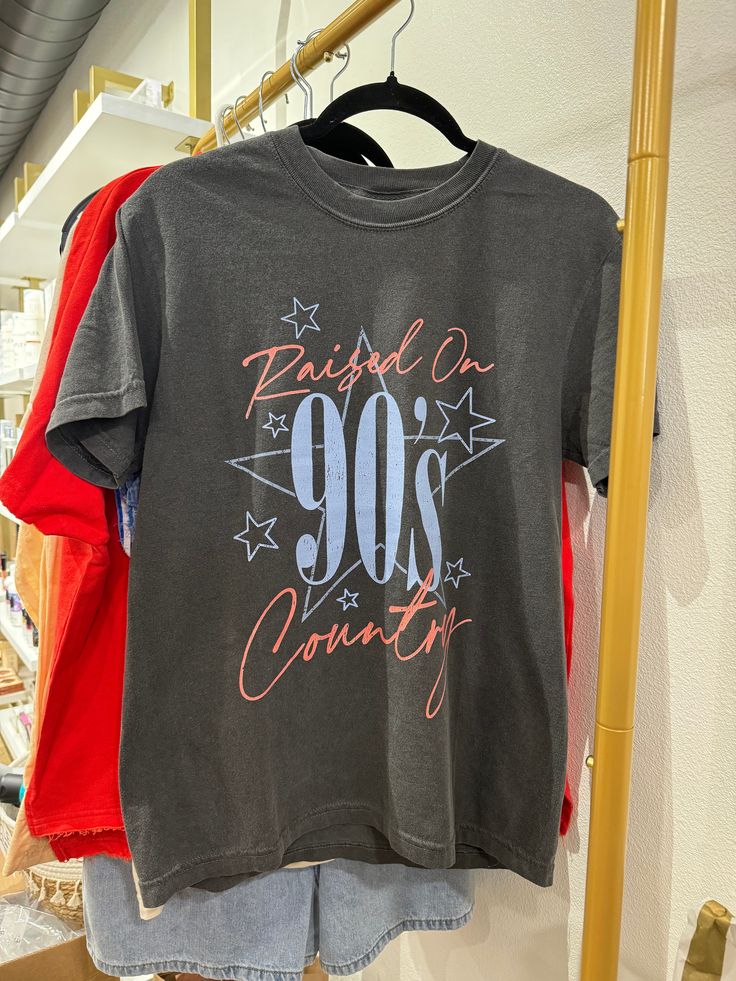 Take a trip down memory lane with our Raised On 90s Country Tee. Perfect for those summer holidays like Memorial Day, 4th of July, and Labor Day weekend. For an oversized look, size up. Relive the good old days with this quirky and fun tee! 90s Inspired Summer T-shirt With Letter Print, 90s Inspired Graphic Print T-shirt For Summer, 90s Inspired Letter Print T-shirt For Summer, 90s Style Summer Screen Print T-shirt, 90s Summer T-shirt With Graphic Print, 90s Style Summer T-shirt With Graphic Print, 90s Inspired Short Sleeve Summer T-shirt, Summer 90s Inspired Graphic T-shirt, 90s Style Pre-shrunk T-shirt For Summer