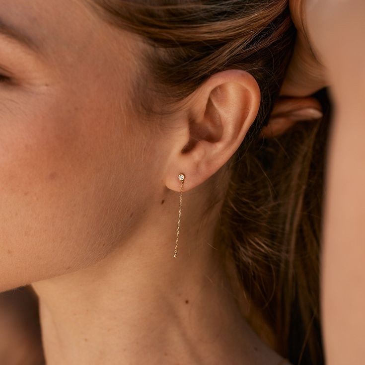 Meet your new favorite statement piece: the Juliet 14K Gold Diamond Earrings. These stunning linear earrings are made with 14k gold and lab grown diamonds for a luxurious touch. With a secure post back closure, these earrings will elevate any outfit! Available in 14k yellow gold Diamond size: 2 mm round diamonds Carat: 0.12 Lab Grown Diamonds Length: 1 1/2" long Post with friction back SKU: BYED0010 Minimalist Yellow Gold Diamond Linear Earrings, Timeless Everyday Diamond Drop Earrings, Timeless Linear Earrings With Diamond Accents, Timeless Linear Earrings In 14k White Gold, Timeless 14k Gold Linear Earrings For Anniversary, Timeless 14k White Gold Linear Earrings, 14k Gold Fine Jewelry Linear Drop Earrings, 14k Gold Drop Linear Earrings Fine Jewelry, 14k Gold Drop Linear Earrings