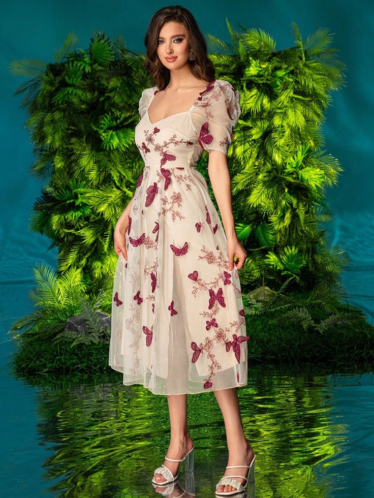 Introducing the Fluttering Beauty dress, designed for the elegant and sophisticated woman. This dress features double bubble sleeves and a 3D butterfly decoration, adding a touch of whimsy to its classic design. Perfect for any occasion, this dress exudes beauty and confidence. Color : Apricot Style : Casual Details : Ruffle, Zipper Pattern Type : Floral, Butterfly, Animal, All Over Print Type : A Line Sleeve Length : Short Sleeve Neckline : Sweetheart Sleeve Type : Puff Sleeve Waist Line : High Spring Party Dress With Butterfly Sleeves, Summer Party Midi Dress With Butterfly Sleeves, Spring Party Dress With Butterfly Print, Summer Midi Dress With Butterfly Sleeves For Party, Fitted Dress With Butterfly Sleeves For Parties, Spring Butterfly Print Party Dress, Fitted Party Dress With Butterfly Sleeves, Chic Butterfly Print Party Dress, Chic Party Dress With Butterfly Print