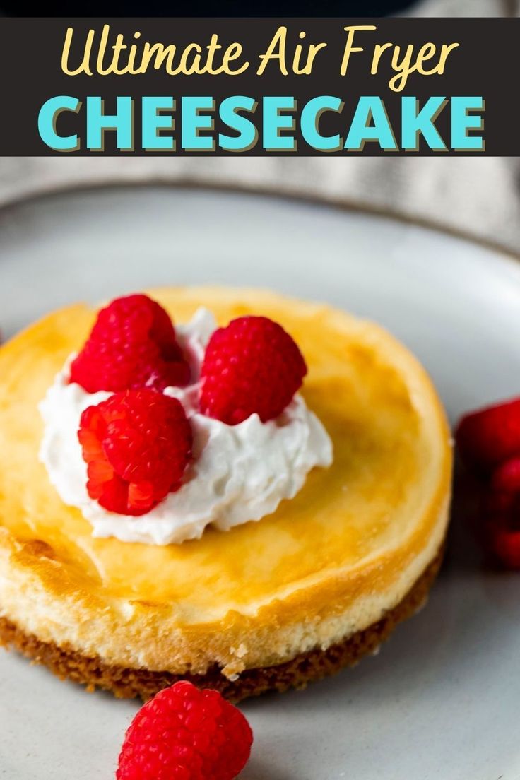 a cheesecake with raspberries on top and the words ultimate air fryer cheesecake