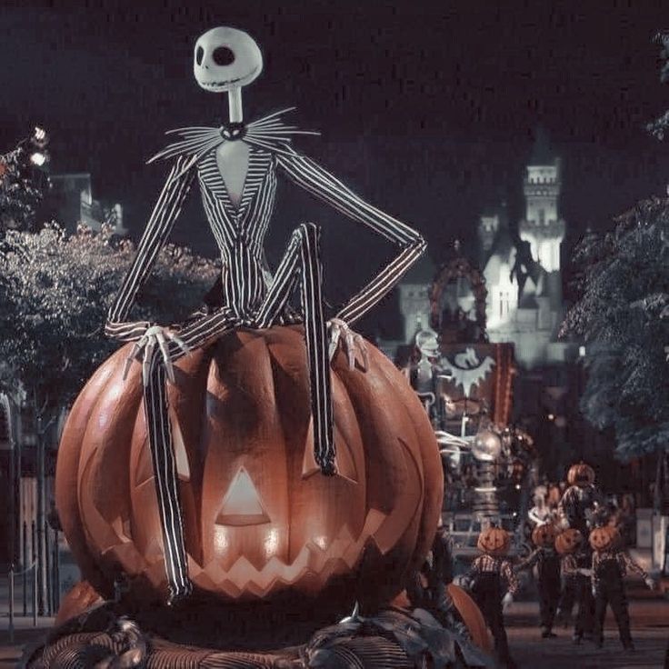 a large pumpkin with a skeleton on it's head