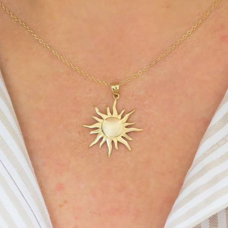 Burning sun figured, handmade 14 K yellow solid gold necklace. Comes with 14k gold chain. (Only pendant option) Standart chain length: 45 cm (17 inches) The size of sun is 22 mm (0,86 inches) diameter. Your lovely sun will arrive in a gift box. Choose your choice of chain lenght. Worldwide Shipping. (DHL/FEDEX/UPS/TNT) Please contact to me for any request. Immerse yourself in the radiant allure of the sun, a celestial orb that has captivated humanity since the dawn of time. Adorn yourself with a Elegant Yellow Gold Sun Design Necklace, 14k Gold Sun Design Jewelry Gift, 14k Gold Sun And Moon Pendant Necklace, 14k Gold Pendant Necklaces With Sun And Moon Design, Dainty Yellow Gold Necklace With Sun And Moon Design, Gold Plated Sun Design Necklace Gift, Gold Plated Sun Design Necklace As Gift, Gold Jewelry With Sun Design In 14k Gold, 14k Yellow Gold Sun Design Necklace