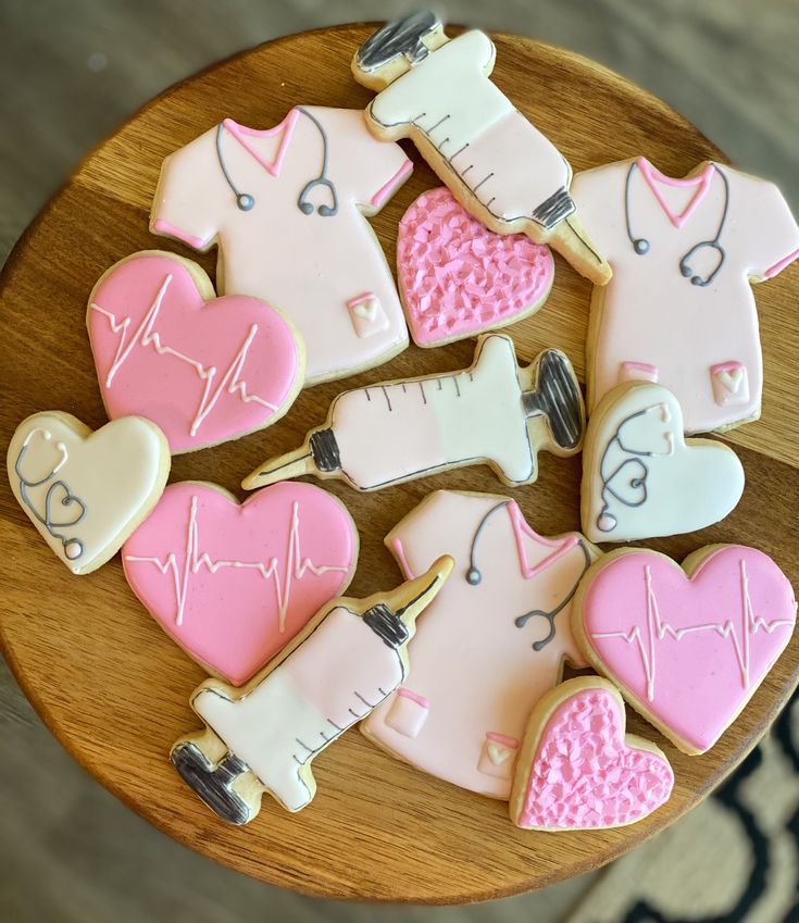 decorated medical cookies arranged on a wooden plate