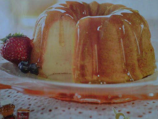 a bundt cake on a plate with berries