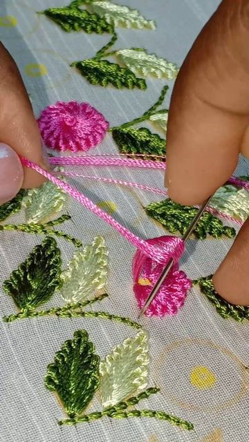 someone is doing something with yarn and scissors on the tablecloth that they are working on