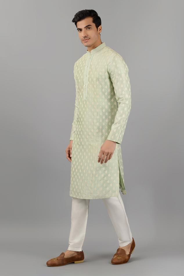 Pistachio green silk kurta with mandarin collar, all over floral butti pattern and thread embroidery. Paired with white straight fit pants.
Components: 2
Pattern: Embroidered
Type Of Work: Thread Work
Neckline: Mandarin Collar
Sleeve Type: Full Sleeves
Fabric: Silk
Color: Green
Other Details: 
Embroidered collar and placket
Side slits on kurta
Kurta Closure: Front button placket
Occasion: Mehendi and Puja,Sangeet - Aza Fashions Kurta Set For Men, Types Of Work, Straight Fit Pants, Silk Kurta, Embroidered Collars, Pistachio Green, Thread Embroidery, Thread Work, Fabric Silk