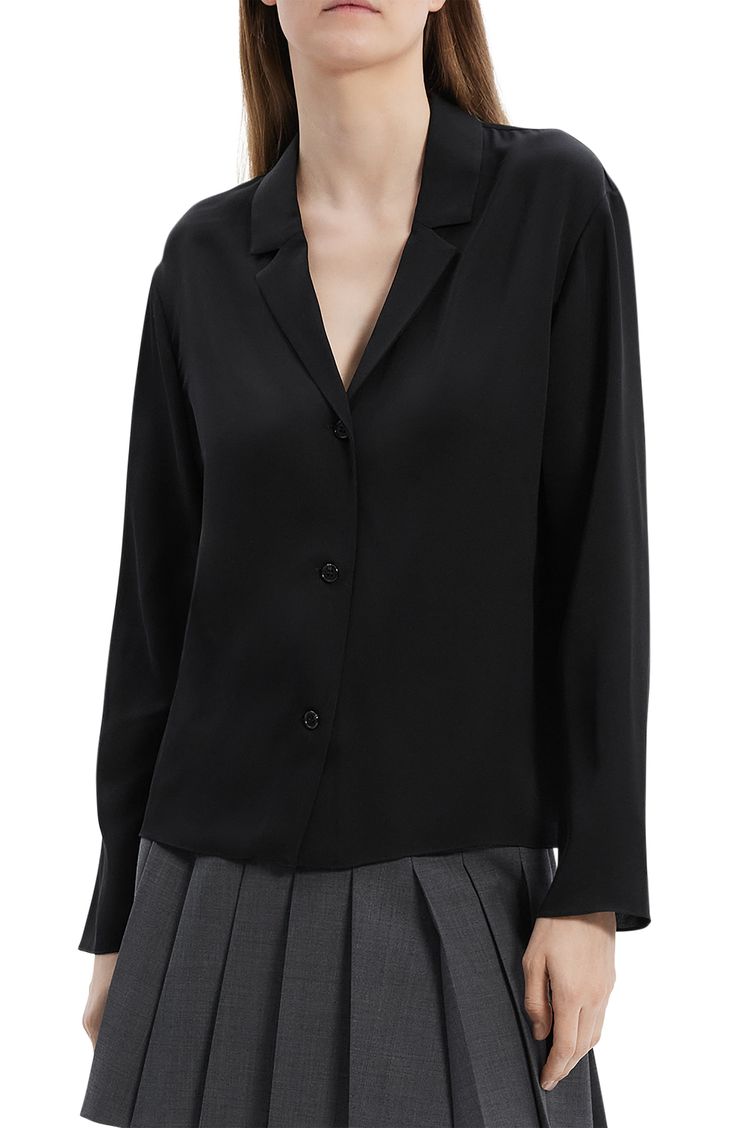 A notched collar and a V-neck soften the look of this supple silk shirt cut in a relaxed, boxy silhouette. 24" length (size Medium) Front button closure Notched collar V-neck Long sleeves 100% silk Dry clean Imported Silk V-neck Blouse With Button Closure, Semi-formal Blouse With Lapel Collar And Placket, Semi-formal Blouse With Lapel Collar, Silk V-neck Shirt For Office, Formal V-neck Shirt With Button Closure, Elegant Single Breasted Tops, Sleek Button-up Blouse With Concealed Placket, Sleek Collared Blouse For Business Casual, Sleek Collared Tops With Concealed Placket