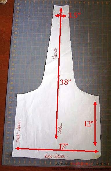 an apron is shown on a cutting board with the measurements for it to be cut