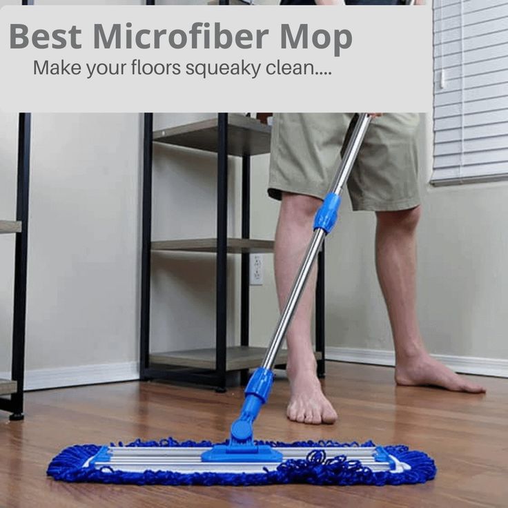 a man is cleaning the floor with a mop