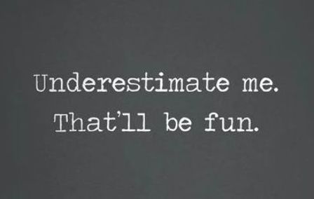 the words underestimate me that i'll be fun written in white on a black background