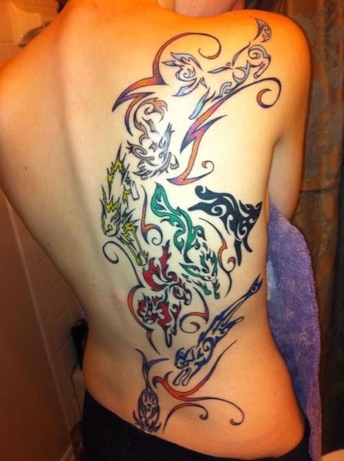 the back of a woman's body with tattoos on her upper and lower half