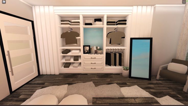 an open closet with clothes on hangers and other items in the room next to it