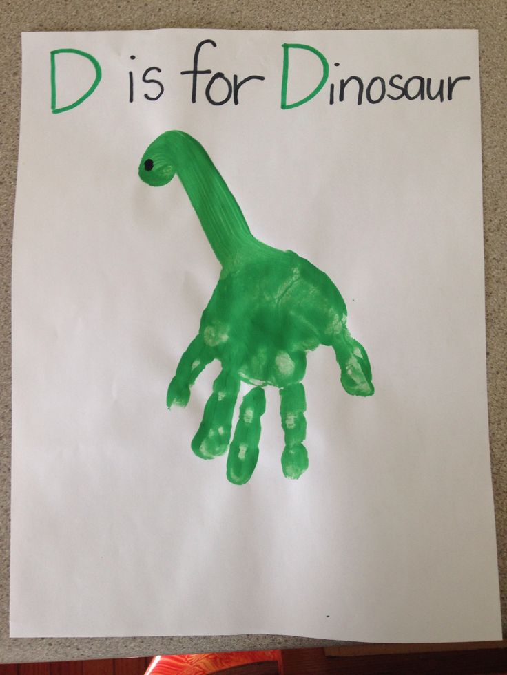 a handprinted dinosaur on a white paper with the words dis for dinosaur