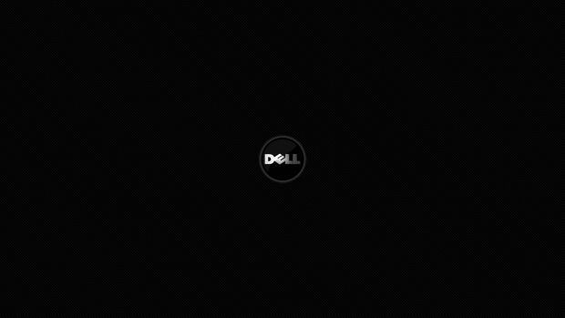 the dell logo is shown in black and white on a dark background with only one light visible