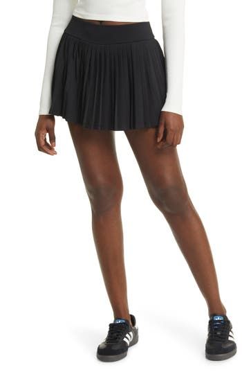 Allover pleats lend swingy movement to this sporty skort designed with a wide, smoothing waistband. 12" length Lined 92% polyester, 8% spandex Machine wash, line dry Imported Black Night, Blackest Night, Nordstrom, Spandex, Size Medium, Black, Design