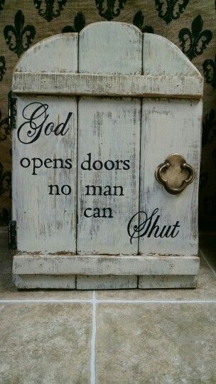 an old door with the words god opens doors, no man can shut it on