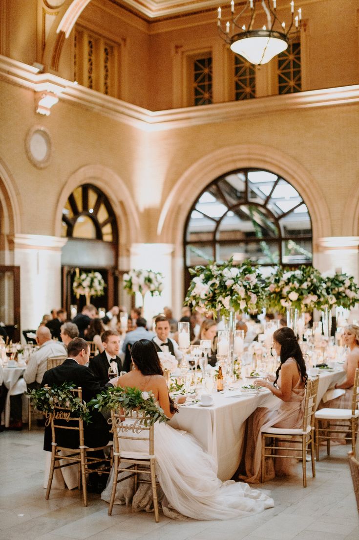 a group of people sitting at tables in a room