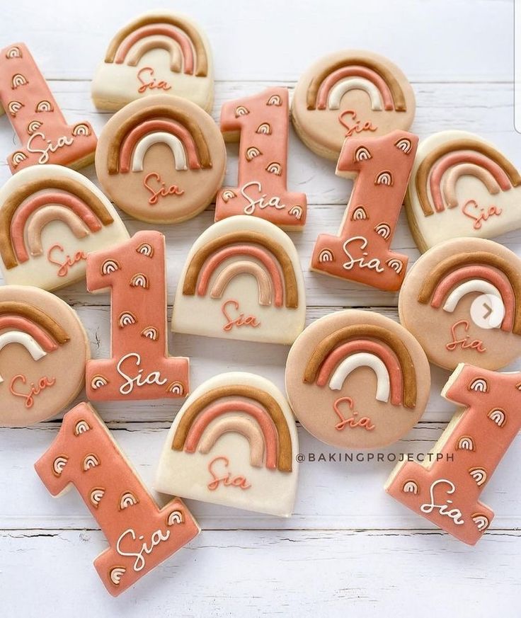 some cookies are arranged in the shape of numbers with rainbows and letters on them