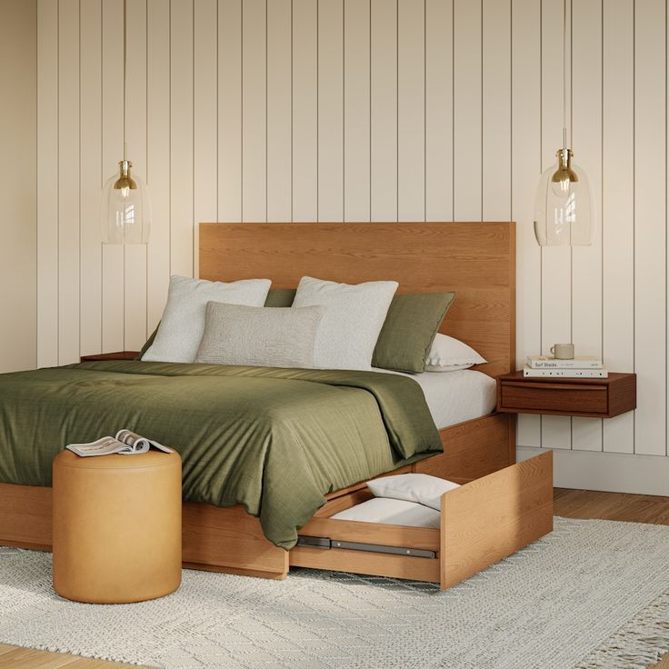 a bed with green sheets and pillows in a bedroom next to a wooden dresser drawer