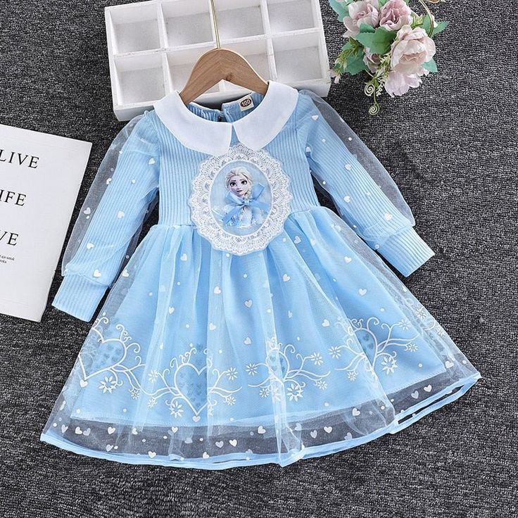 This high-quality long-sleeved Toddler Girls Elsa Dress is crafted from soft, breathable cotton and mesh, with a stylish ball gown silhouette and adorable cartoon design. Perfect for putting on a royal display at any time, this dress is designed for girls aged 2-8 years. Comfortably lightweight, the dress also features a full-length sleeve and a flattering O-neck. Let her experience the enchantment of Arendelle with this stunning Elsa dress--perfect for dress-up games with her pals! Transform yo Long Sleeve Tutu Dress For Dress-up In Spring, Long Sleeve Tutu Dress For Spring Dress-up, Cute Long Sleeve Dress For Dress-up, Cute Long Sleeve Dress-up Dresses, Playful Long Sleeve Dress-up Dresses, Playful Long Sleeve Dress For Dress-up, Blue Long Sleeve Tulle Princess Dress, Blue Tulle Princess Dress With Long Sleeves, Winter Princess Style Tutu Dress In Tulle