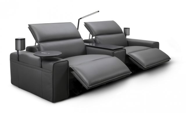 the reclining sofa has two seats and a cup holder on one end, while the rest of the couch is empty